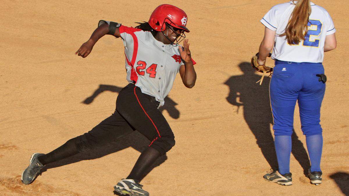 JOHN FITZHUGH/SUN HERALD 
 Harrison Central's Daijah Richardson rounds third to score against St. Martin during the fourth inning of their 6A South State softball playoff game at Harrison Central in Lyman on Saturday May 7, 2016.