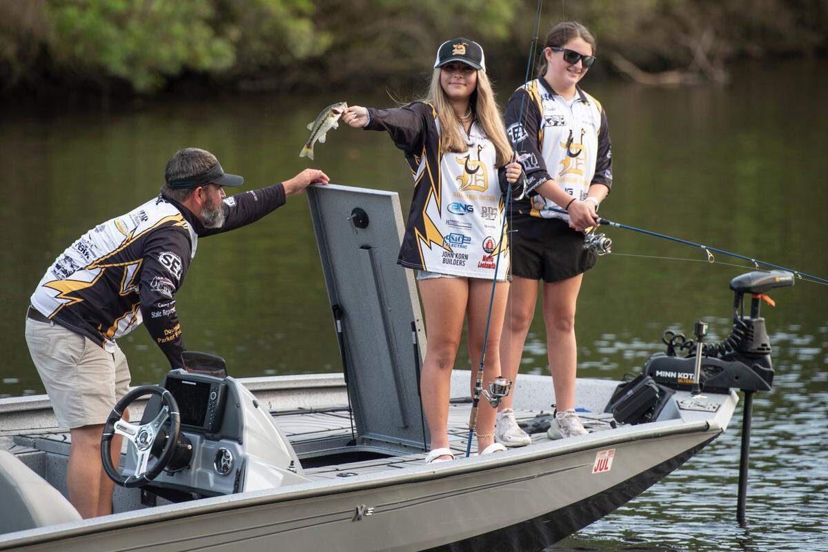 D’Iberville Bass Fishing Team member Harper Krohn shows off a fish she caught while fishing on the Tchoutacabouffa River in D’Iberville with her teammate Olivia King on Monday, June 3, 2024.