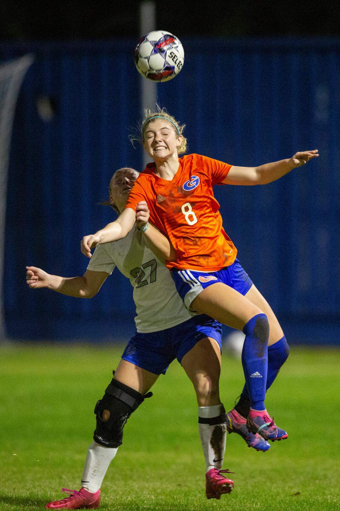 Gulfport’s Chloe Brock heads the ball away from Ocean Springs’ Jaylen Bodry during the 6A South State Championship game in Gulfport on Tuesday, Jan. 31, 2023.