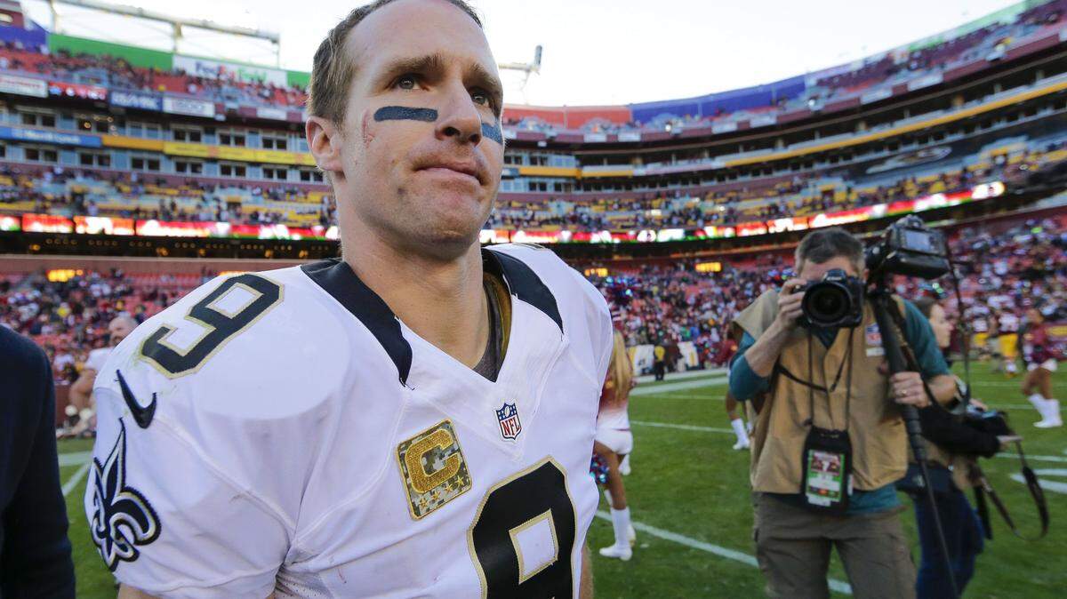 AP PHOTO/MARK TENALLY 
 New Orleans Saints quarterback Drew Brees (9) walks off the field after an NFL football game against the Washington Redskins in Landover, Md., Sunday, Nov. 15, 2015. The Redskins defeated the New Orleans Saints 47-14.