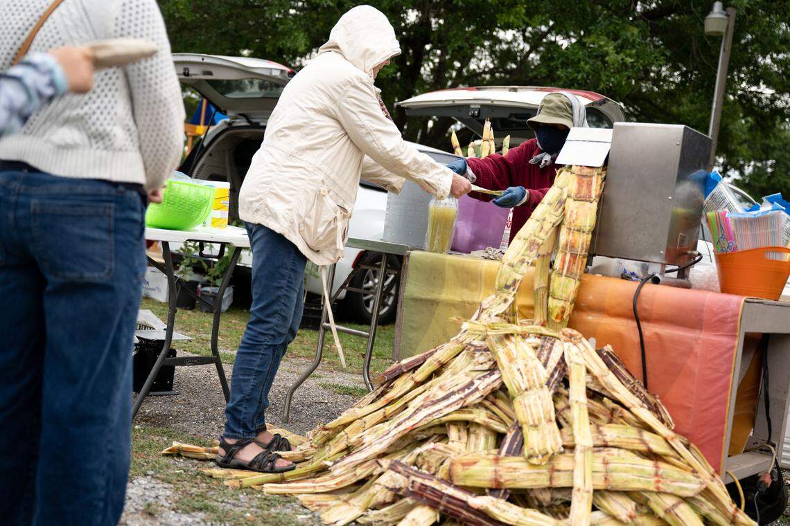 Sugarcane drinks are served during Songkran at the Wat Buddhametta Mahabaramee in Gautier on Sunday, April 19, 2026.