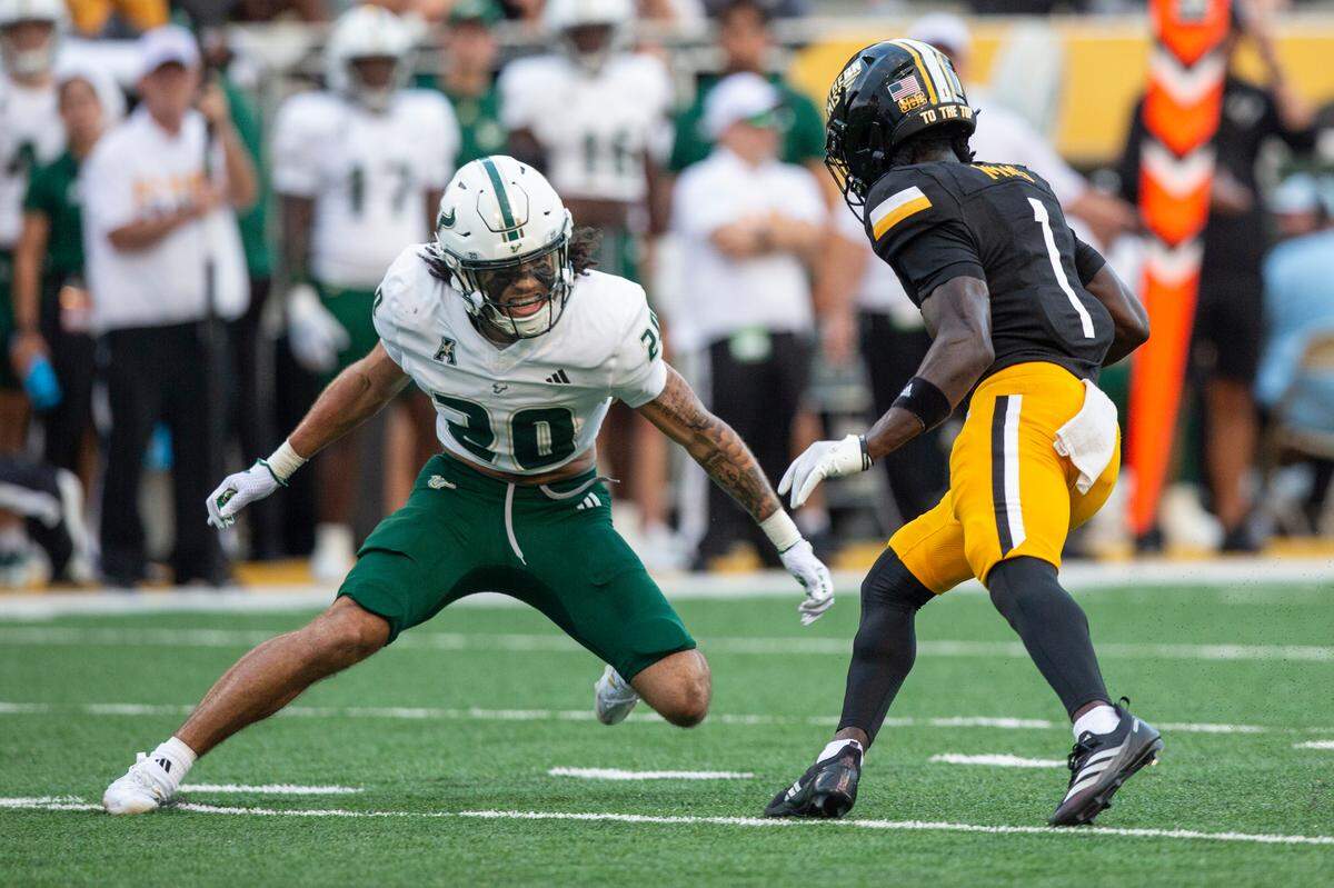 Southern Miss Golden Eagles wide receiver Tiaquelin Mims (1) runs the ball past South Florida Bulls cornerback Brent Austin (20) during a game between Southern Miss and South Florida at M.M. Roberts Stadium in Hattiesburg on Saturday, Sept. 14, 2024.