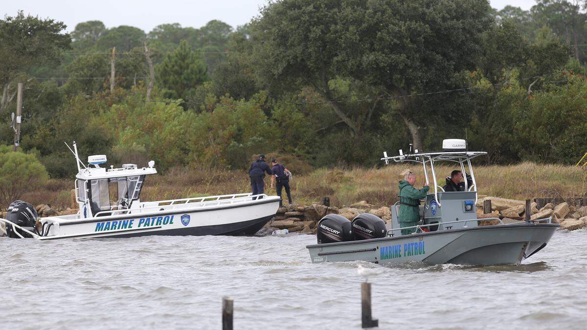 JOHN FITZHUGH/SUN HERALDDepartment of Marine Resources personnel search for a plane missing in the waters south of Belle Fontaine Beach in Jackson County on Tuesday Oct. 27, 2015