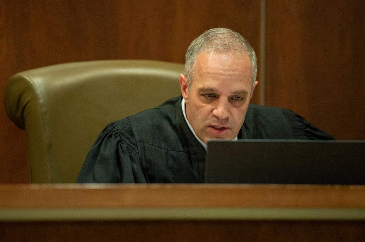 Judge Brandon Ladner talks with witnesses and defendants over a zoom call during an initial hearing for three men, who are charged with murder at a residence in Gaston Point over New Year’s Eve, at Harrison County Justice Court in Gulfport on Wednesday, Jan. 19, 2022.