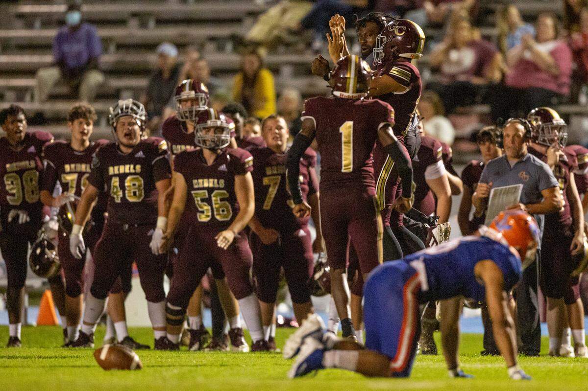 The George County sidelines cheer as George County knocks away a pass to Gulfport during a game against Gulfport at Milner Stadium in Gulfport on Friday, Aug. 26, 2022.