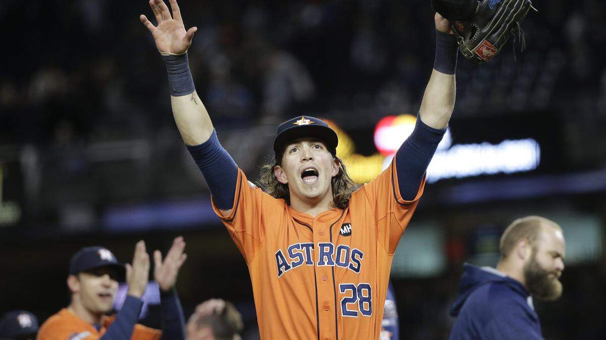 Houston Astros left fielder Colby Rasmus (28) motions to fans after the Astros defeated the New York Yankees 3-0 in the American League wild card baseball game, Tuesday, Oct. 6, 2015, in New York. (AP Photo/Julie Jacobson)