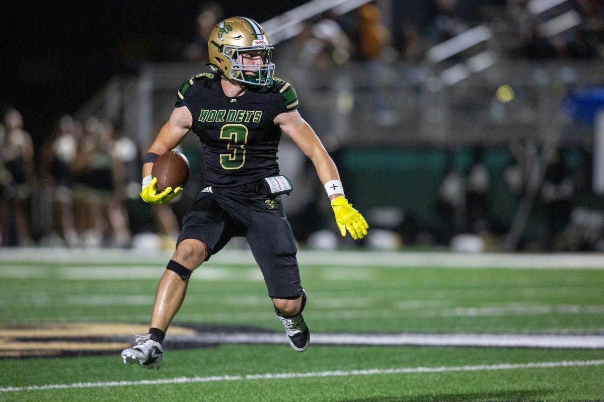 Poplarville’s Nick Miller runs the ball during a playoff game between Poplarville and Mendenhall at Poplarville on Friday, Nov. 8, 2024.