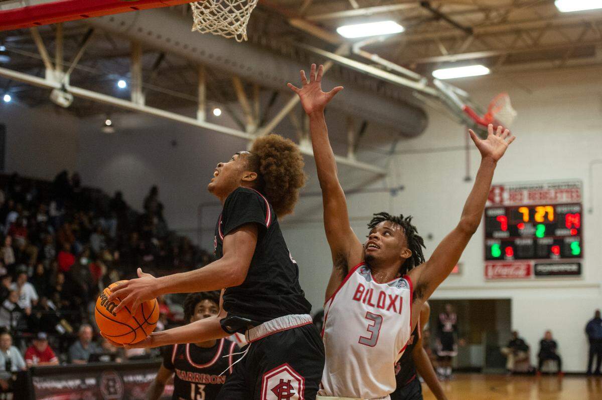 Biloxi’s James Turner defends the basket from Harrison Central during the district title game at Harrison Central High School in Gulfport on Friday, Feb. 10, 2023.