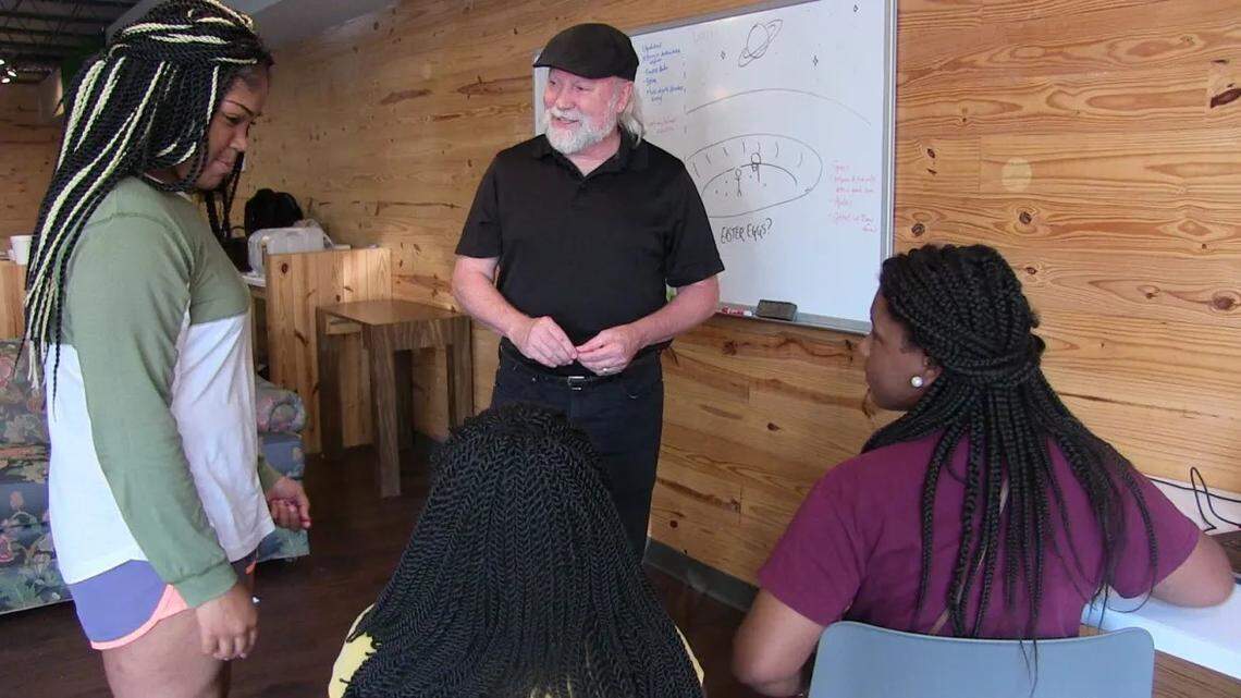Lobaki founder Vince Jordan (center) talks with students in Clarksdale in this 2017 file photo.