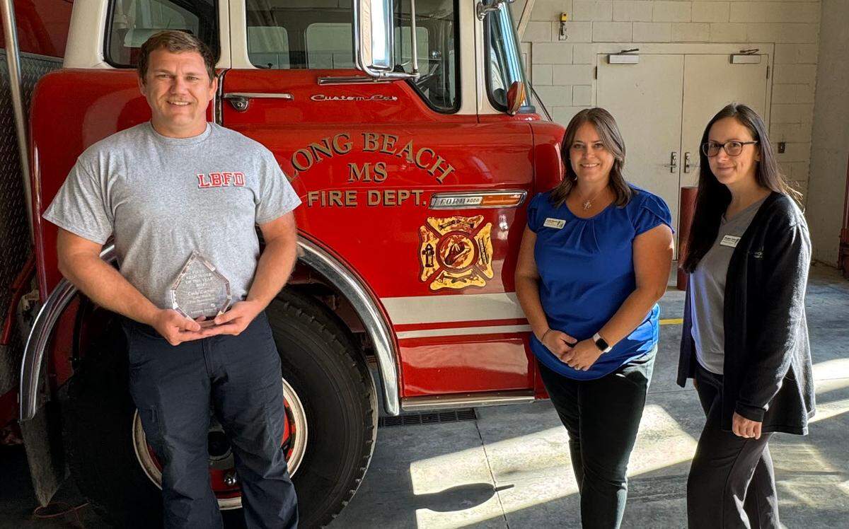 Long Beach Fire Department’s Lieutenant Cody Carroll, Keesler Federal’s Long Beach Branch Manager Leslie Harvey, Keesler Federal’s Long Beach Assistant Branch Manager Heather Asher.&nbsp;