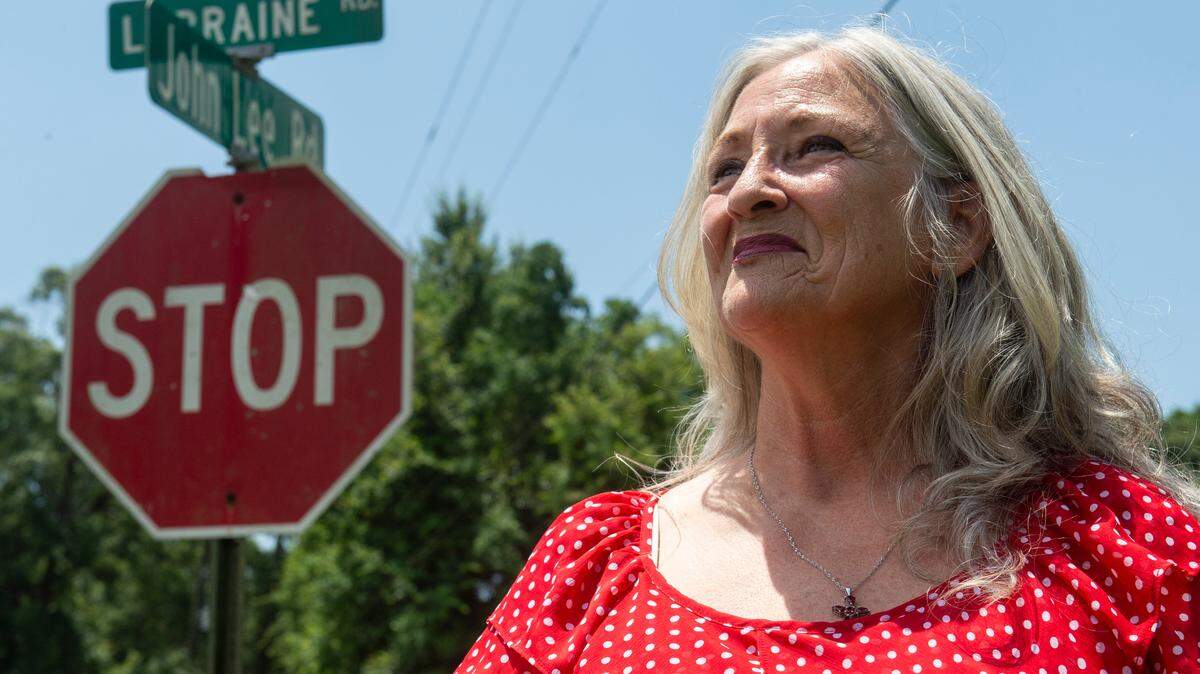 Connie Cushman stands on the corner of John Lee Road, which is named for her grandfather, on Monday, June 24, 2024.