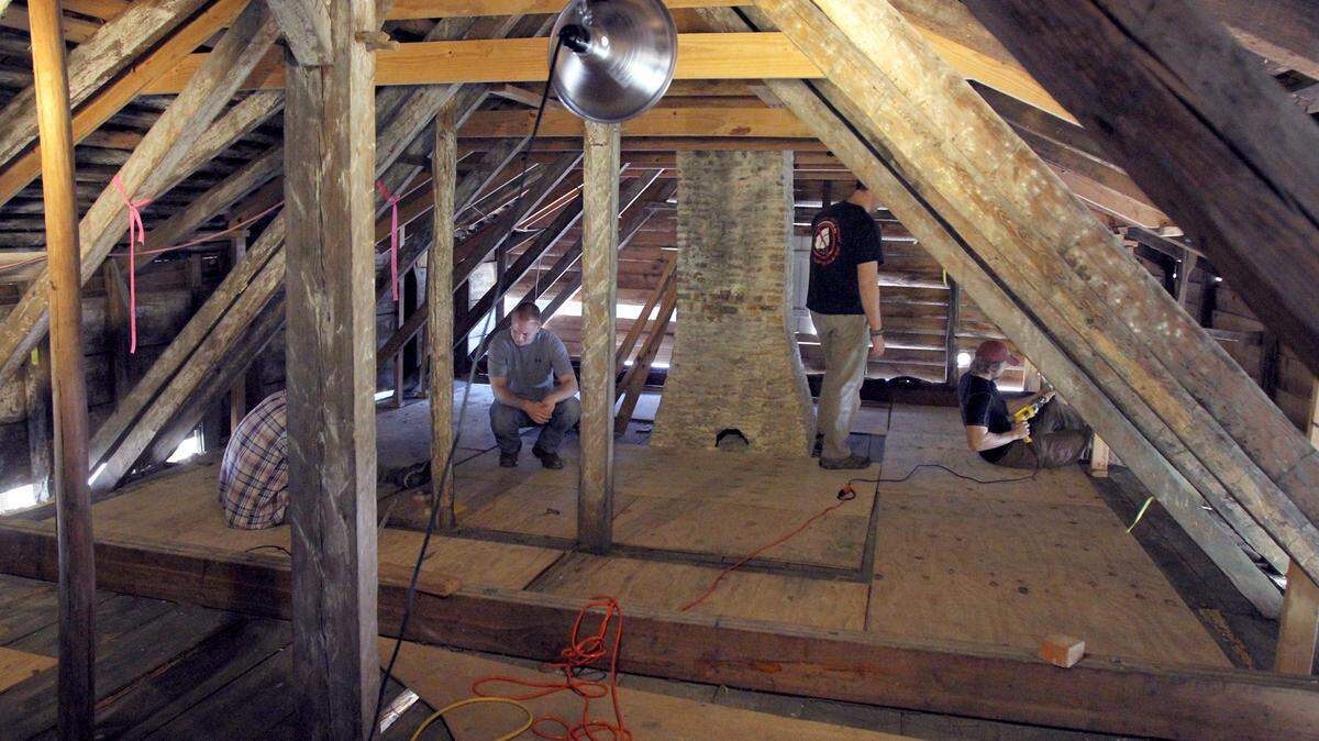 TIM ISBELL/SUN HERALD 
 A crew from Southern Miss and its Dendron Lab are taking samples of the wood from the LaPointe-Krebs House in hopes of dating the material used to built the historic structure.