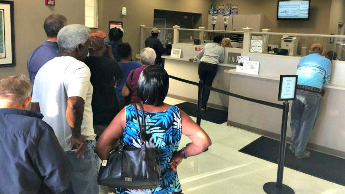This file photo shows more than 25 customers were waiting in line at the Mississippi Power office in downtown Biloxi, which is one of the locations that will close by October.  Customer offices will only be located in Gulfport, Hattiesburg and Meridian by fall, Mississippi Power announced.