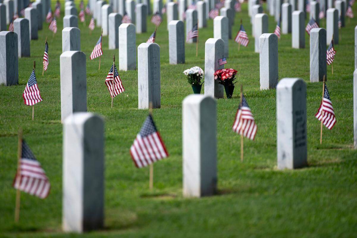 Thousands of tiny American flags decorate the graves of American service members at Biloxi National Cemetery in Biloxi ahead of Memorial Day on Saturday, May 25, 2024.