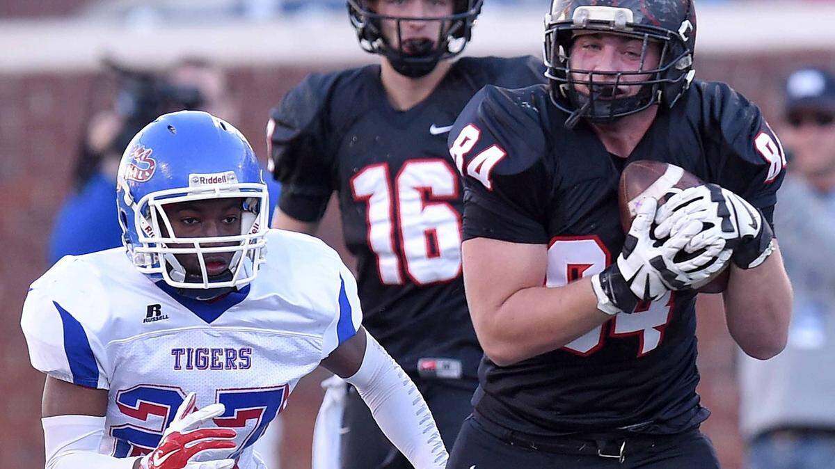St. Stanislaus receiver Tommy Reeder (84) catches a pass over the middle against Noxubee defender Eddison Little (27) on Saturday, December 5, 2015, in the MHSAA Class 4A State Football Championship in Vaught-Hemmingway Stadium on the Ole Miss campus in Oxford.
