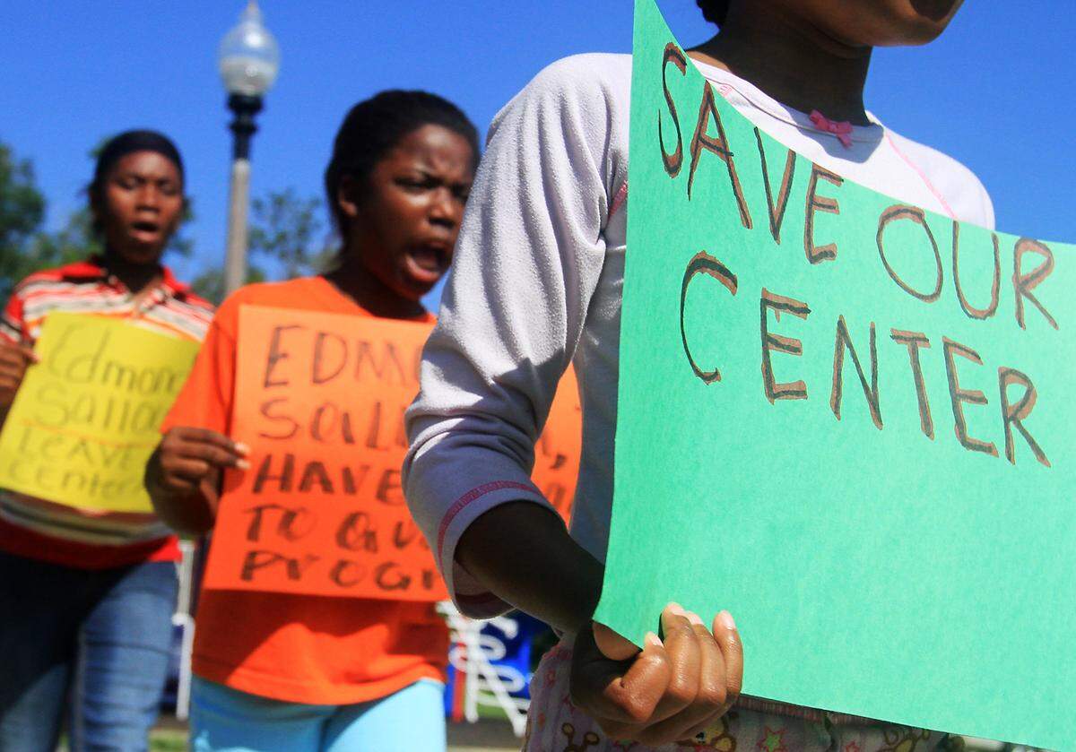 Local children, some still in their pajamas, picket outside of the Willie Locke Community Center in protest against its closing on Thursday, May 27, 2010, in Gulfport. The community center had been home to an after-school tutorial program provided by the Soria City Civic Organization. The city decided not to renew a lease for the building with the school district that has expired.