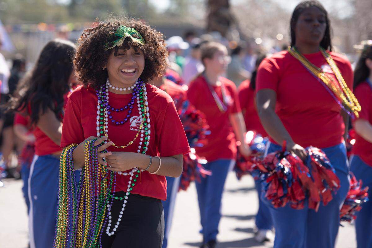 The Pascagoula High School marching band marches during the Jackson County Carnival Association Mardi Gras parade in Pascagoula on Saturday, March 1, 2025.