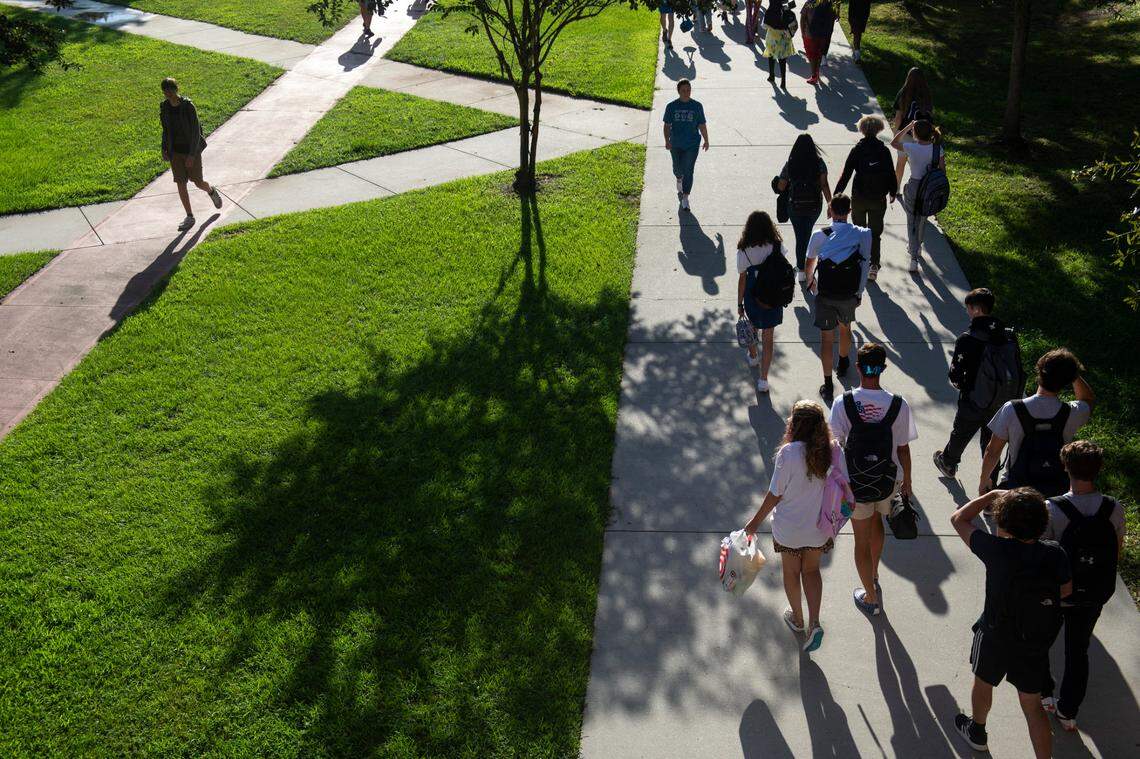 High school students walk between classes on the first day of school at Ocean Springs High School in Ocean Springs on Friday, Aug. 5, 2022.