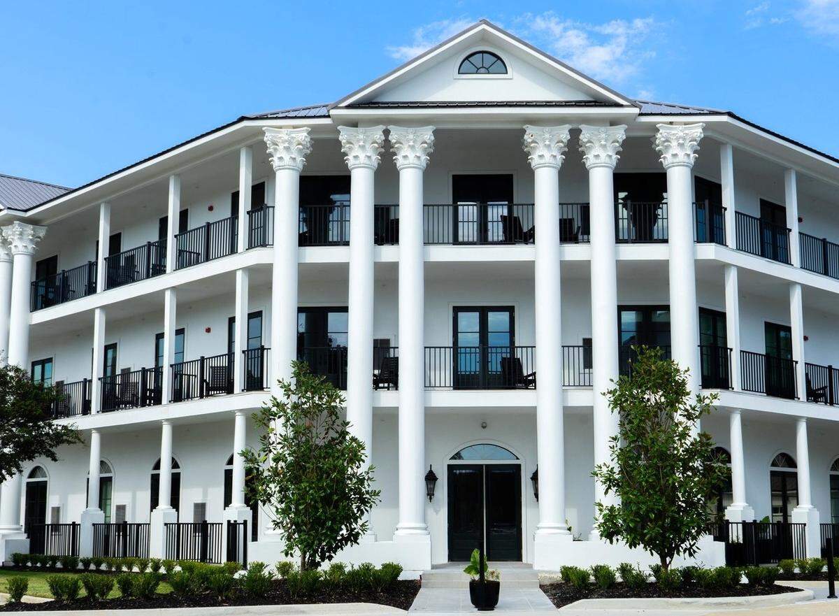 The newly-opened expansion of the White House Hotel in Biloxi has columns and architecture that complement the style of the original hotel on Beach Boulevard. It also has balcony with rocking chairs and water views for some of the rooms.