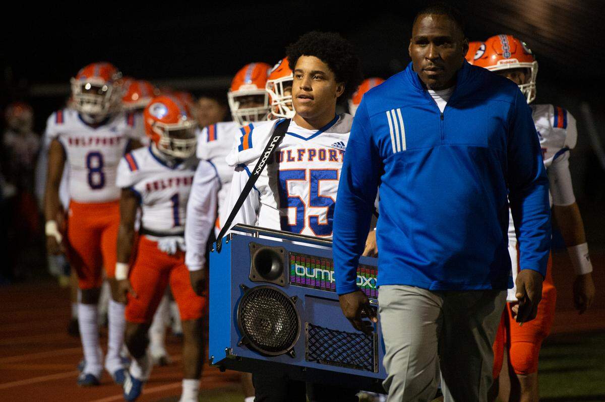 Gulfport’s Jayden Gaines walks into Greyhound Stadium in Ocean Springs with a boombox before Gulfport’s game against Ocean Springs on Friday, Oct. 28, 2022.