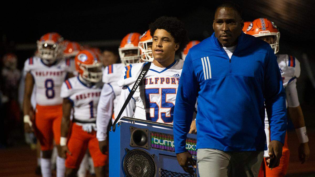 Gulfport’s Jayden Gaines walks into Greyhound Stadium in Ocean Springs with a boombox before Gulfport’s game against Ocean Springs on Friday, Oct. 28, 2022.