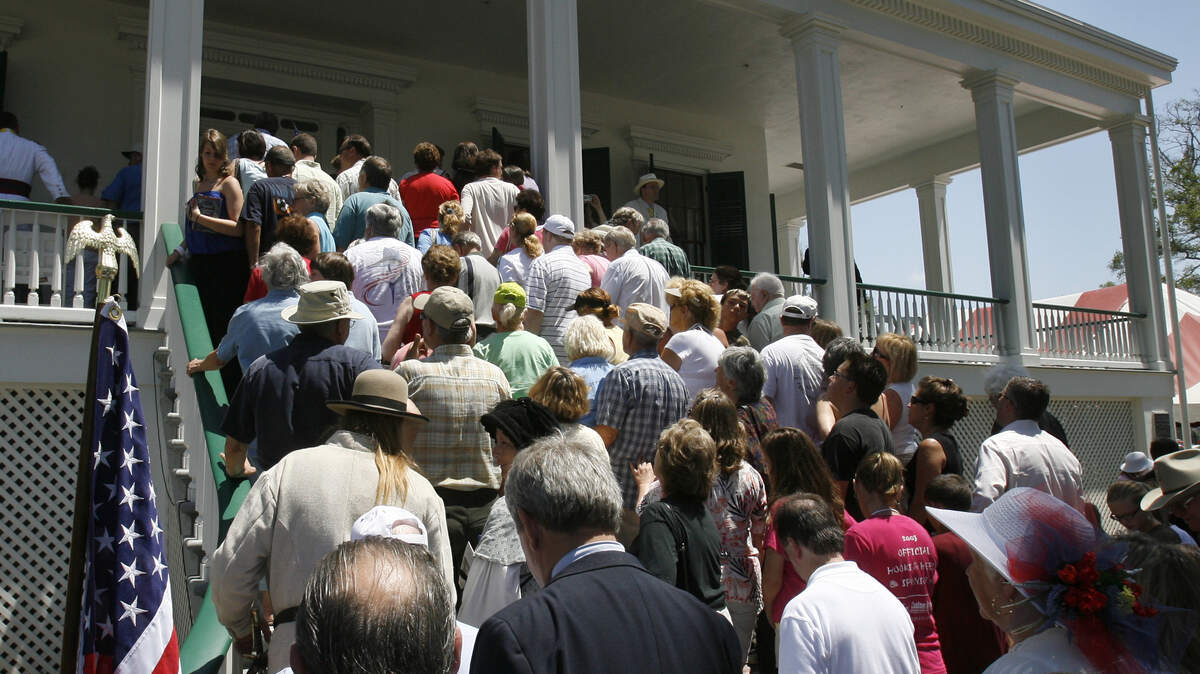 Hundreds crowded the steps of the re-opened Beauvoir to get a glimpse of the renovation that has been done to the building after it was nearly destroyed by Hurricane Katrina.