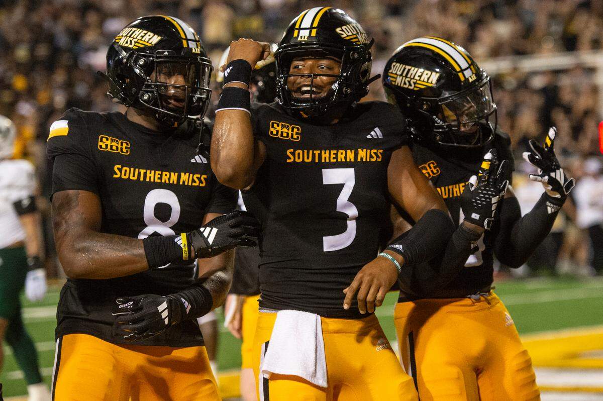 Southern Miss Golden Eagles tight end Justyn Reid (8) and Southern Miss Golden Eagles quarterback Ethan Crawford (3) celebrate after a touchdown during a game between Southern Miss and South Florida at M.M. Roberts Stadium in Hattiesburg on Saturday, Sept. 14, 2024.