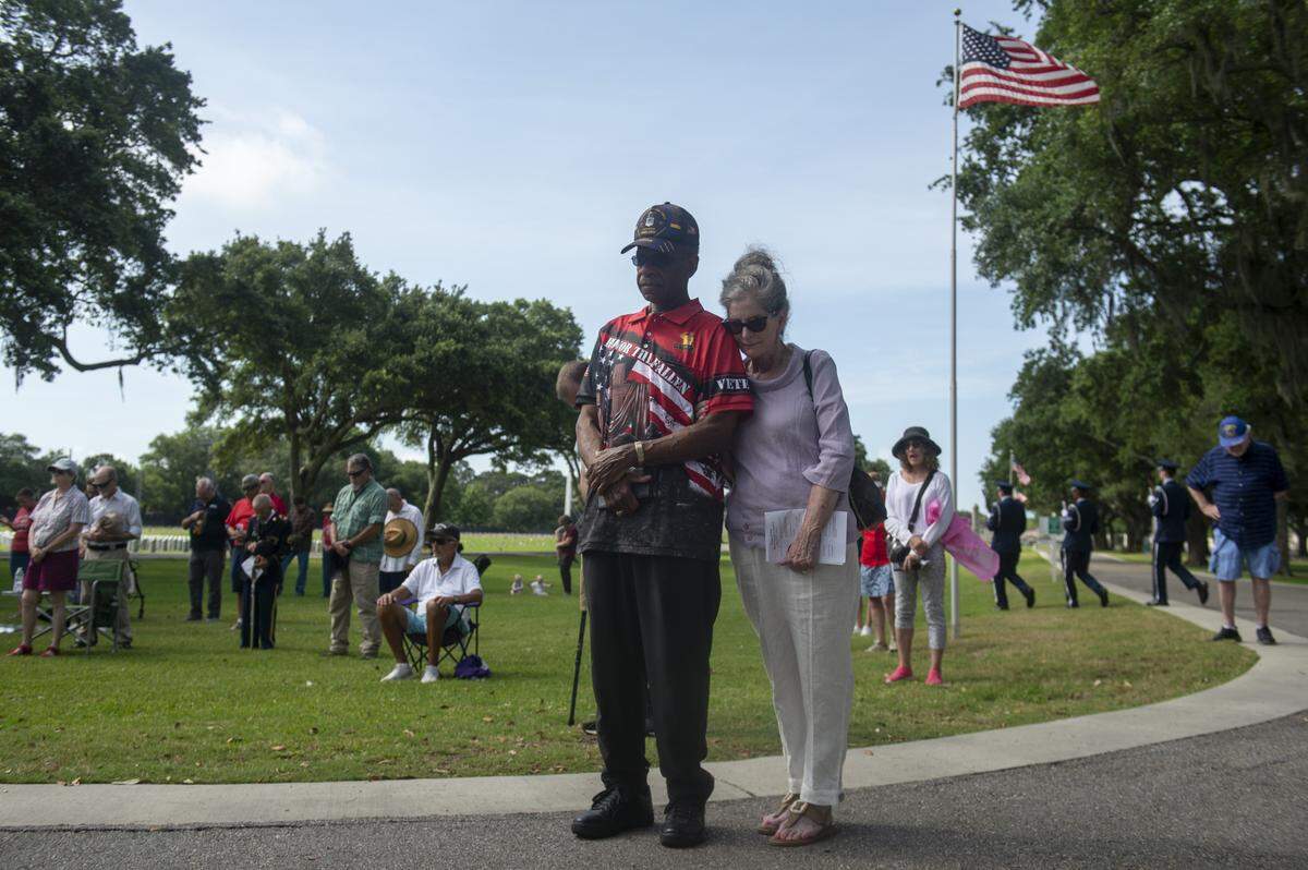 Virgil and Leslie Jefferson pray during a Memorial Day ceremony at Biloxi National Cemetery in Biloxi on Monday, May 26, 2025.