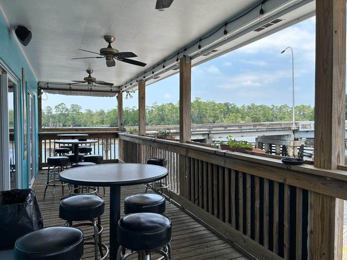 The balcony overlooking the Tchoutacabouffa River at The River Peach Bar and Grill in Biloxi, Mississippi.