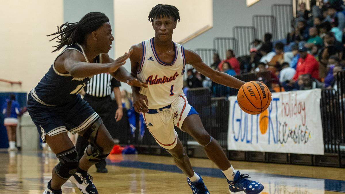 Gulfport’s Kamari Mitchell, right, dribbles the ball down the court during a matchup with Moss Point during the Adidas Holiday Classic at Gulfport High School in Gulfport on Tuesday, Dec. 28, 2021.