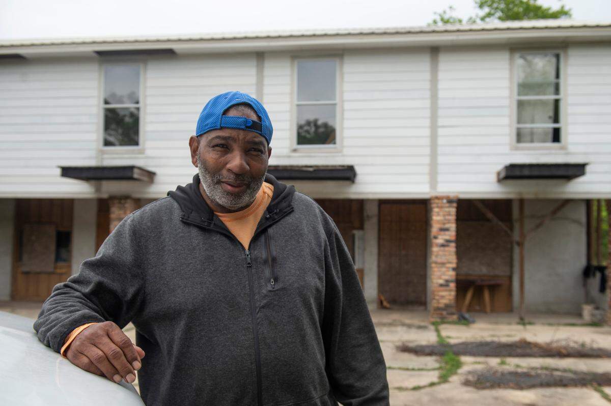Charles Vincent, a developer who lives and owns property in Backatown, poses for a portrait outside a building on Washington Street in Bay St. Louis that he plans to turn into apartments and offices on Tuesday, April 12, 2022.