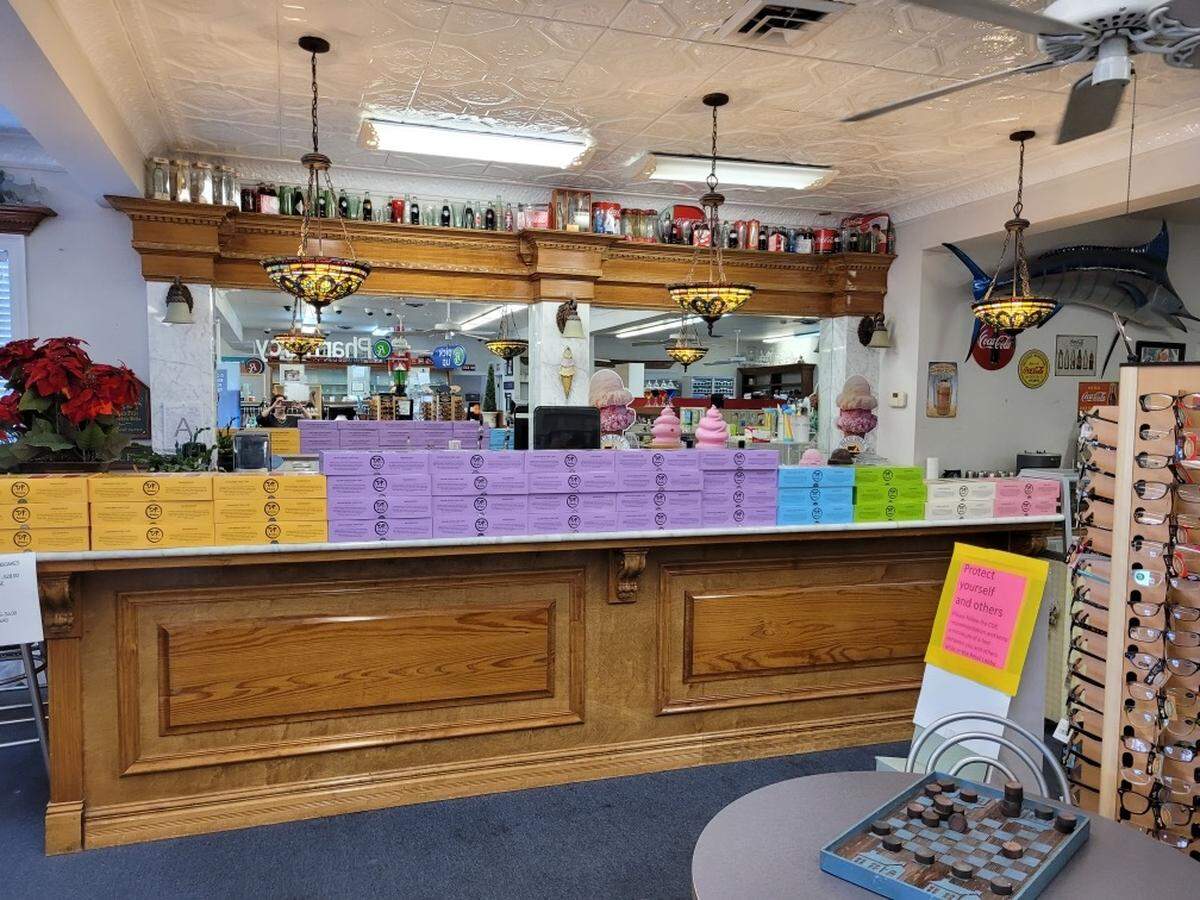 King cakes from the Dong Phuong Bakeshop in New Orleans are stacked on the counter of Waveland Pharmacy, one of three places the award-winning cakes are available in South Mississippi.
