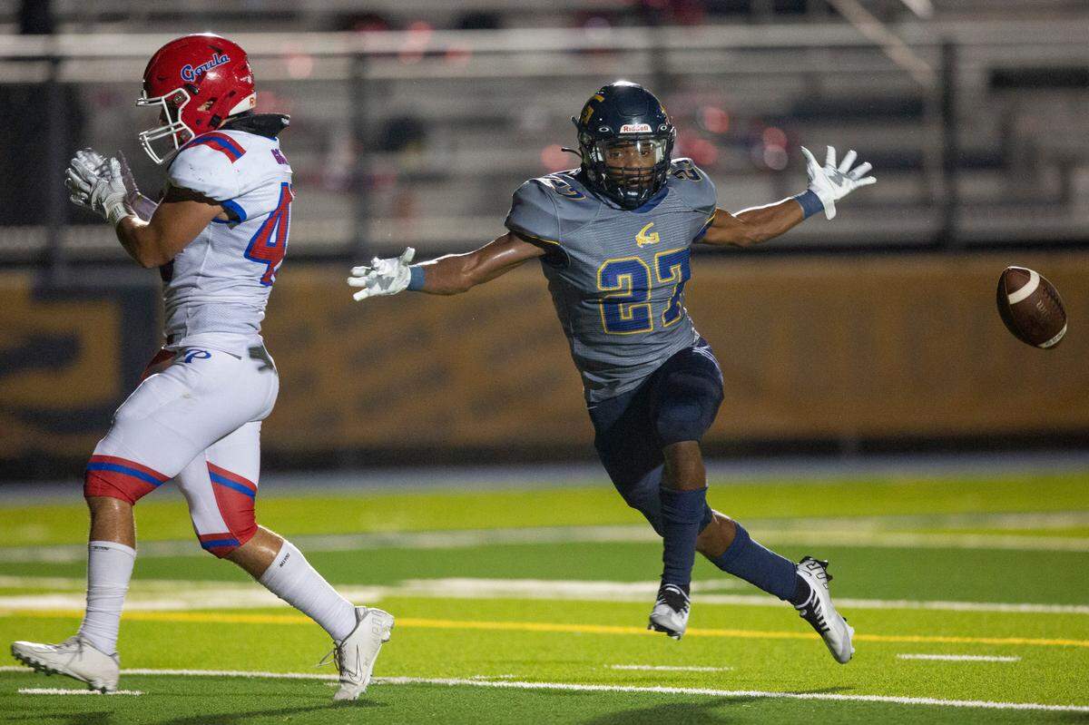 Gautier’s Dominic Smith knocks the ball away from Pascagoula’s Tank Bishop for an incomplete pass during a game against Pascagoula at Gautier High School in Gautier on Friday, Sept. 2, 2022.