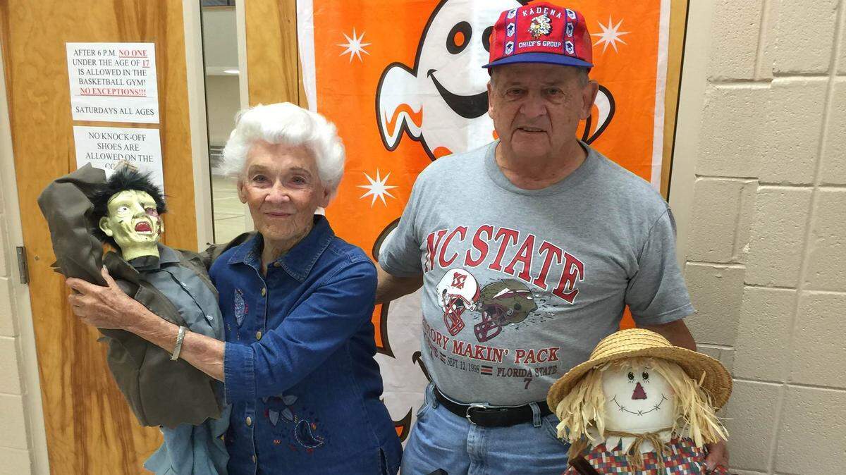 JEFF CLARK/SPECIAL TO THE SUN HERALDMary Elizabeth Stevens and John Snow help decorate the Donal Snyder Community Center in Biloxi for the Seniors Halloween Bash on Friday.