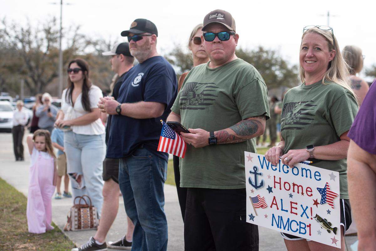 Stephanie and Larry West await the arrival their son Alex West, a member of Naval Mobile Construction Battalion 1, as he returns home from deployment on Thursday, March 13, 2025, to Naval Construction Battalion Center Gulfport.