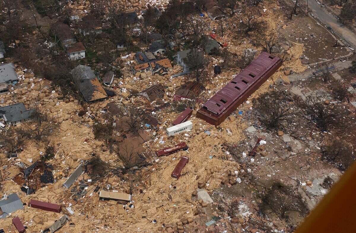 An industrial transport barge sits next to Hurricane Katrina debris from cargo that was washed into a West Gulfport neighborhood from the state port in Gulfport.