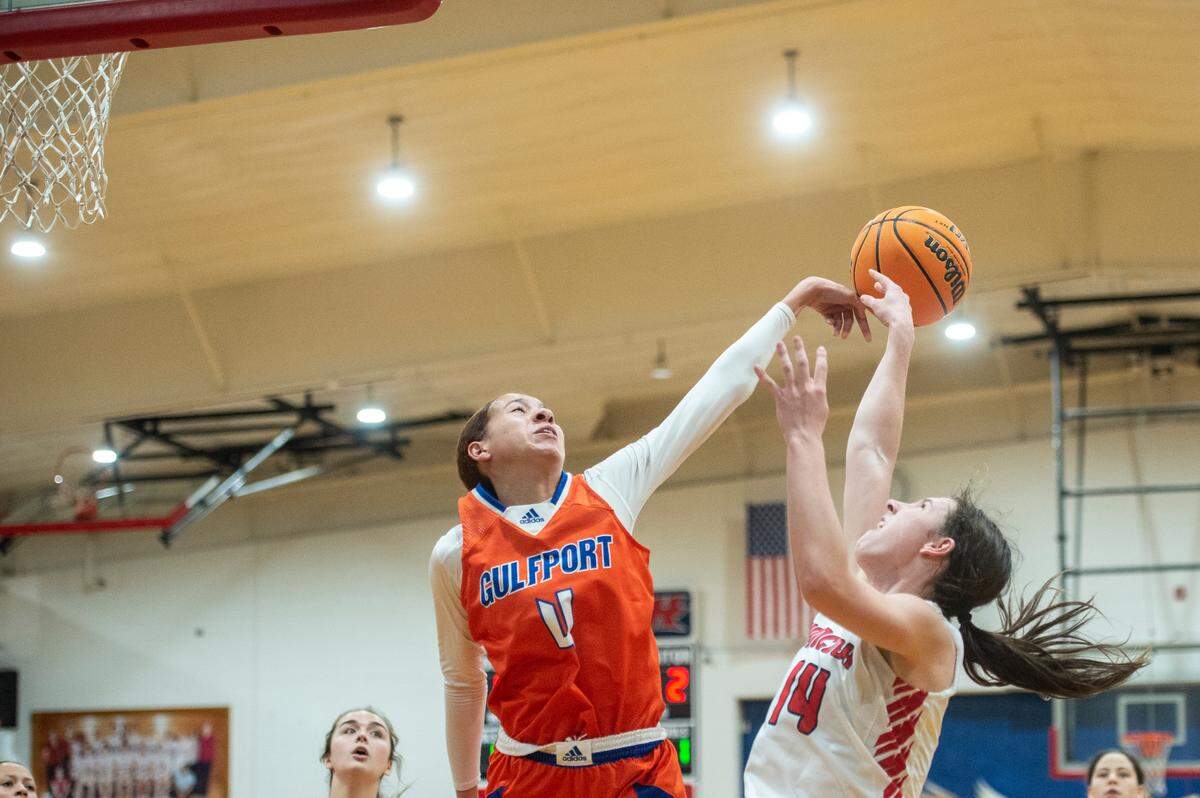 Gulfport’s Micah O’Dell blocks a shot from Hancock’s Anslee James during a game between Hancock and Gulfport at Hancock High School in Kiln on Tuesday, Jan. 10, 2023.