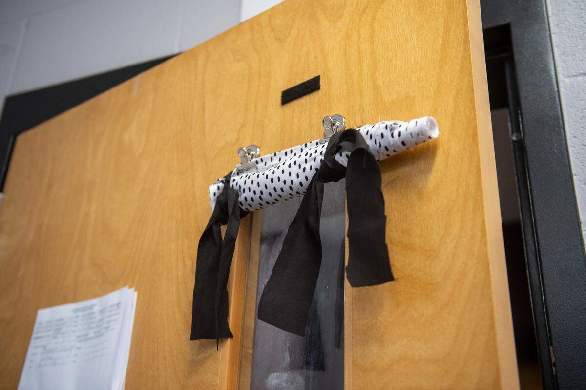 A pull down curtain on classroom window at Long Beach High School on Thursday, Sept. 26, 2024. All of the classrooms in the high school have curtains for interior and exterior windows which can be pulled down in the event of an intruder or other threat.