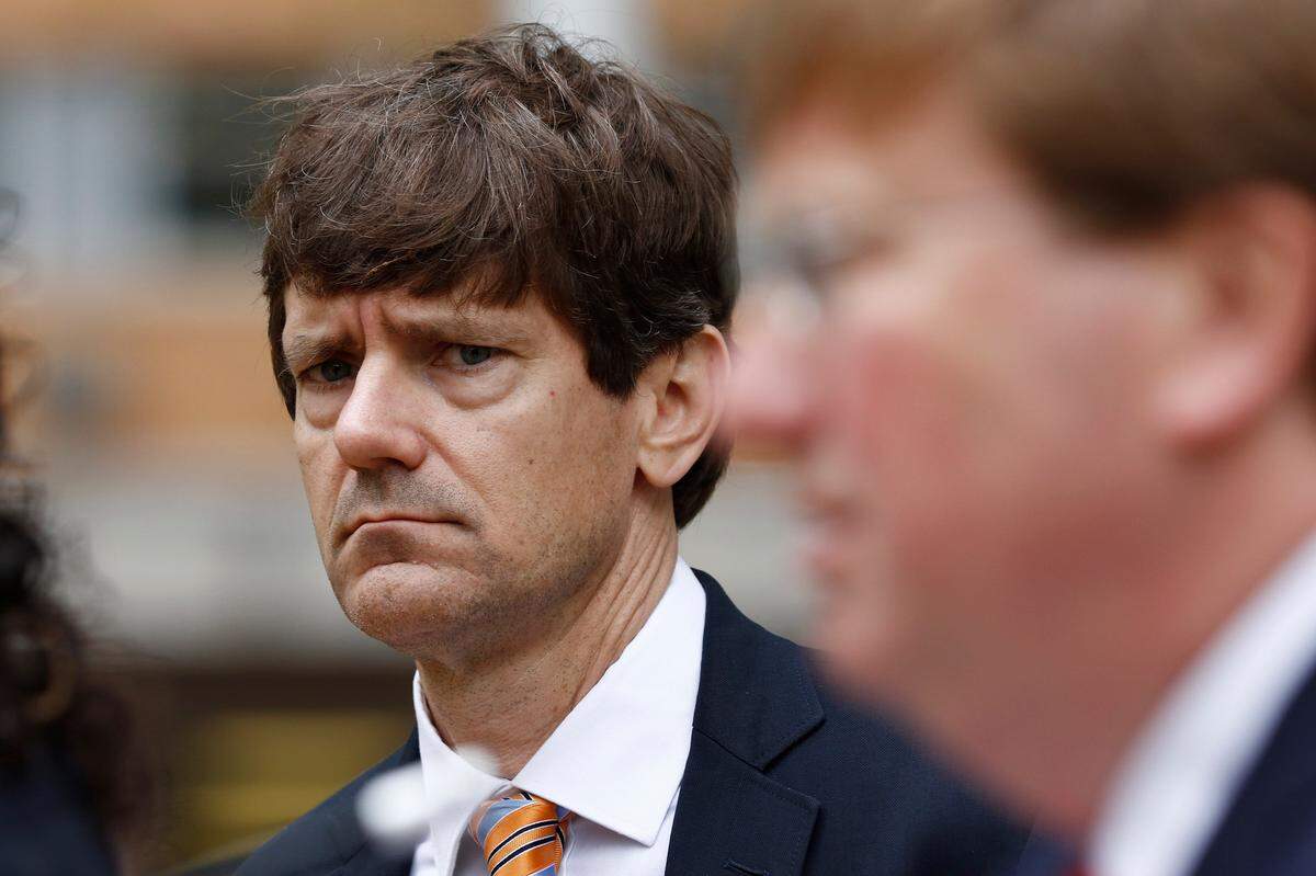 State Health Officer Dr. Thomas Dobbs, left, listens as Republican Gov. Tate Reeves speaks with reporters outside the Governor’s Mansion to give an update on the current situation of COVID-19 and coronavirus in the state and discuss Mississippi’s ongoing response to slow the spread, Tuesday, March 24, 2020 in Jackson, Miss.