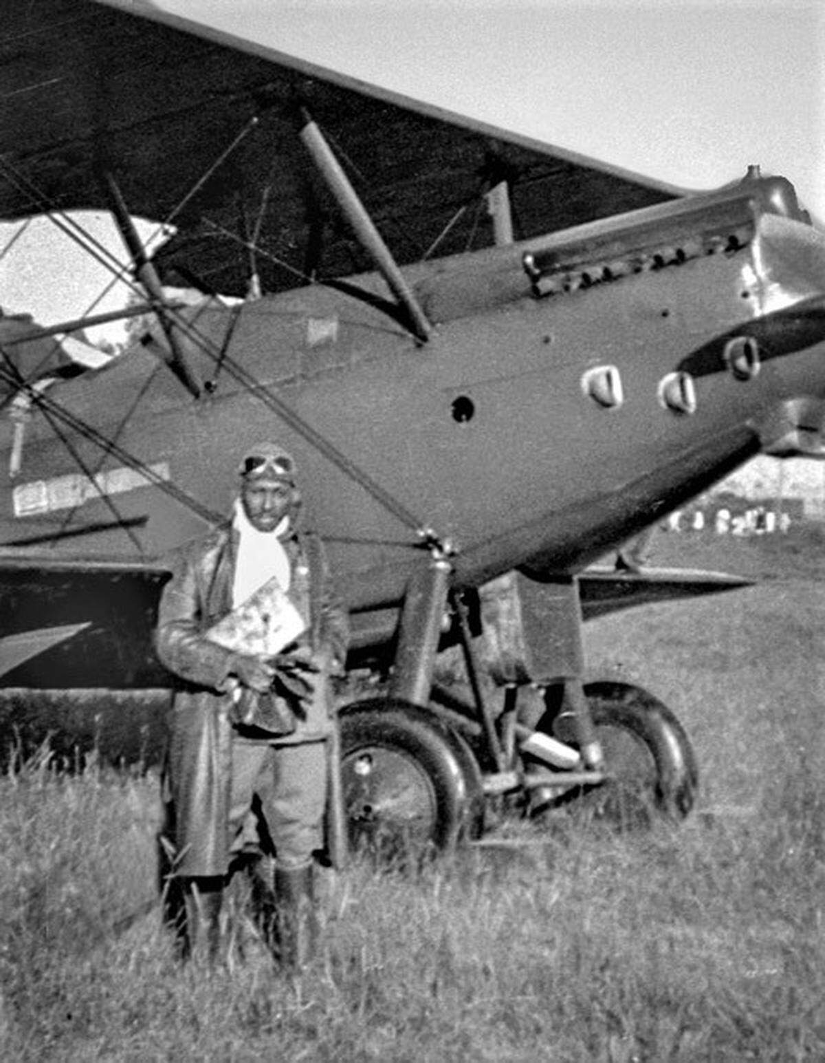 When John C. Robinson was commissioned commander of the Ethiopian Air Force, many of the air craft were French-made Potez biplanes. He stands in front of one before a mission.