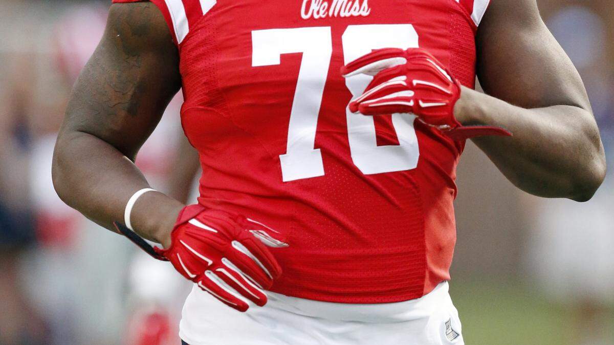 Mississippi offensive lineman Laremy Tunsil (78) loosens up prior to his team's NCAA college football game against Texas A&M in Oxford, Miss., Saturday, Oct. 24, 2015. Tunsil was making his first start for the season having served a seven game suspension. No. 24 Mississippi won 23-3. (AP Photo/Rogelio V. Solis)