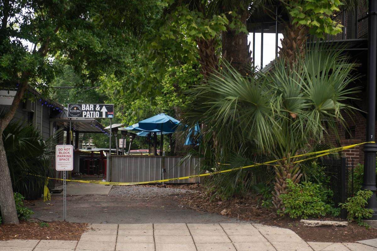 Crime scene tape still decorates The Scratch Kitchen bar and restaurant in Ocean Springs on Monday, May 8, 2023, after a shooting killed one at the restaurant on Friday.