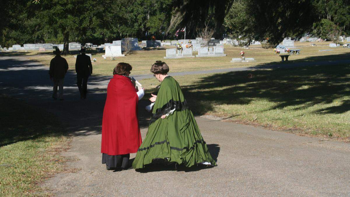 COURTESY/DEIDRE DENBLEYKER 
 Janet Beatty and Jeannie Dixon in period costumes portray their ancestors at last year's Griffin Cemetery Tour in Moss Point. Some graves in the cemetery date back to the 1700s.