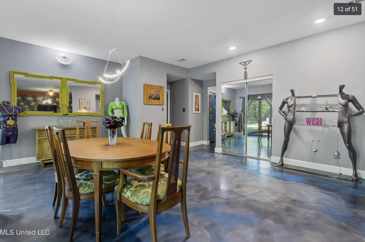 A home for sale on Graveline Road in Gautier has purple and orange walls, mirrors and mannequins throughout.