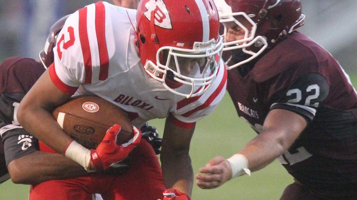 JOHN FITZHUGH/SUN HERALD 
 Long Beach linebacker Kevin Wayne Jr. (22) broke Richie Brown's LBHS single-season and career tackle records this year.