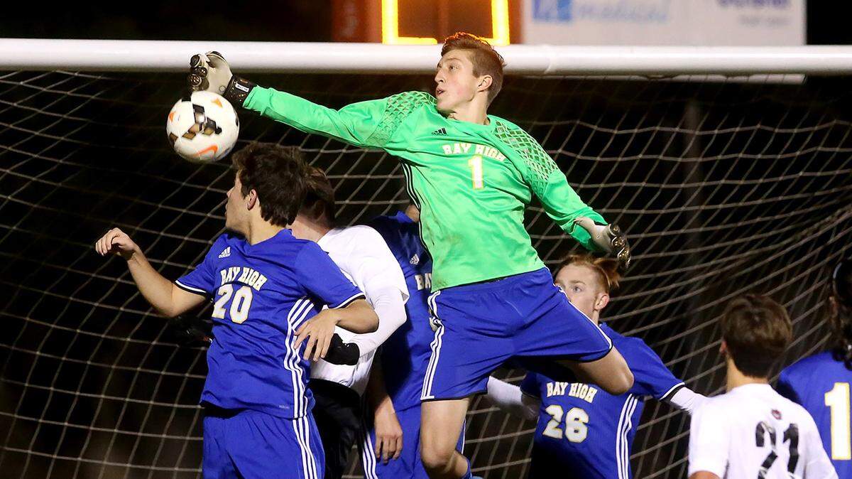 Bay High goalie John Bowman knocks the ball away from the net while competing against St. Stanislaus in the South State playoffs on Tuesday, January 31, 2017. Photographer’s comments: This was a great save by John Bowman that made a great shot.