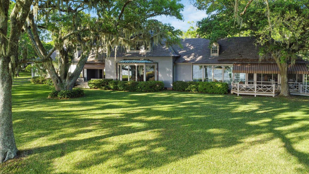 This Acadian-style home is one of two on 93 waterfront acres for sale in Ocean Springs. A second house and more acreage was added to the property by the New Orleans owner, who bought it from a fellow New Orleanian. The property served as a second home and haven for both owners.