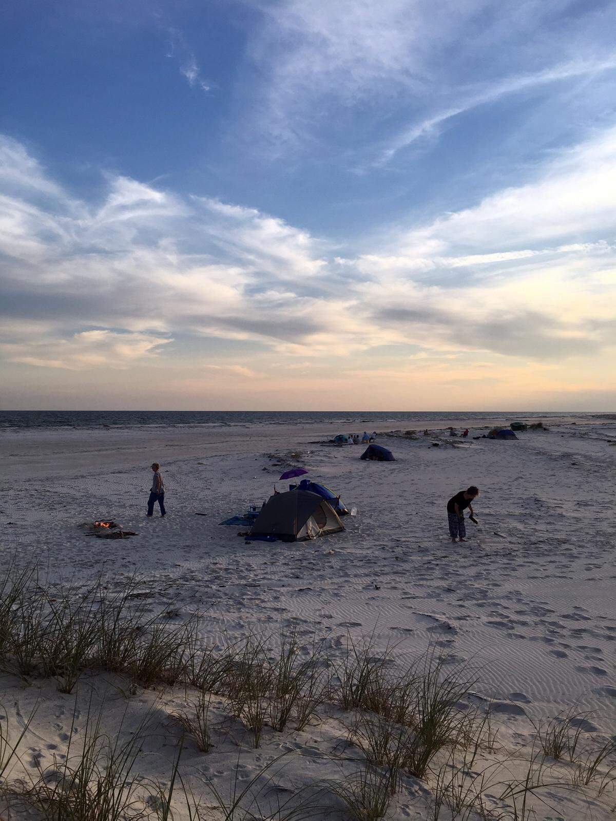 Campers on the Walter Anderson Museum of Art excursion start fires outside their tents on Saturday, May 14, 2016. A group of property owners on the island have listed it for $25 million, but it’s a protected national wilderness area.