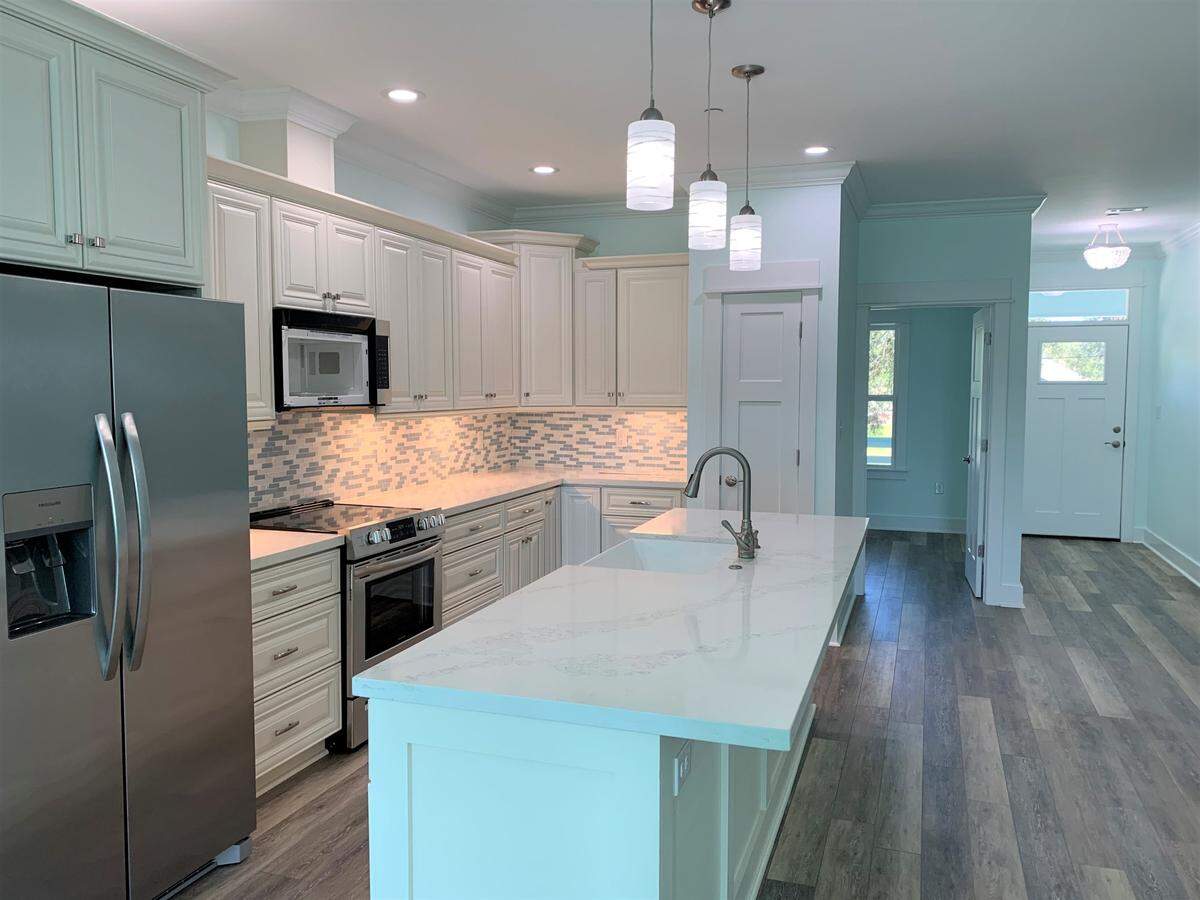 The kitchens in the Sandpiper Townhomes on Fifth Street in Long Beach have a tropical touch along with high-end finishes and appliances.