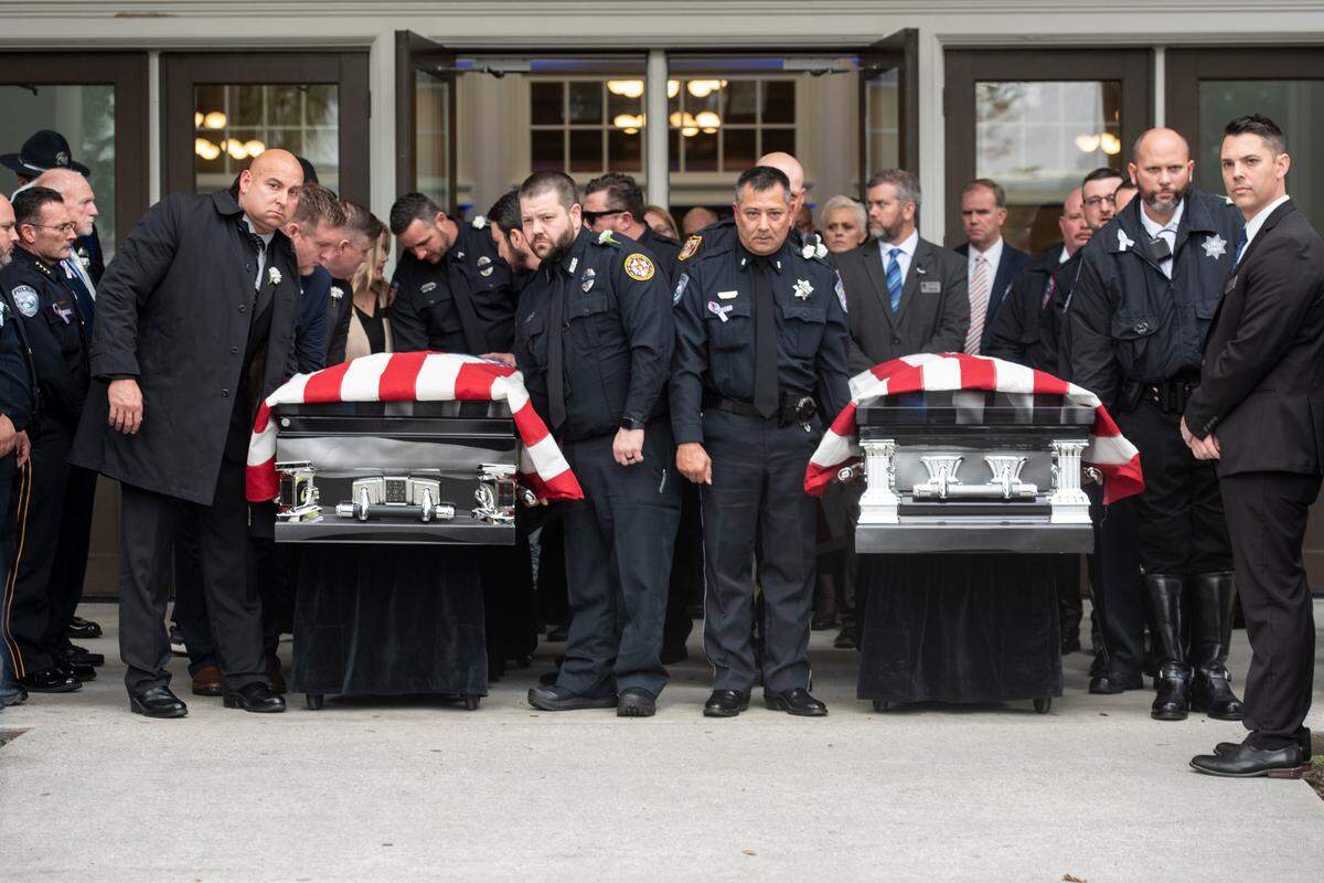 Law enforcement officers prepare to carry the caskets of Bay St. Louis police officers Sgt. Steven Robin and Branden Estorffe following their funeral at the Bay St. Louis Community Center in Bay St. Louis on Wednesday, Dec. 21, 2022. Robin and Estorffe were killed responding to a call at a Motel 6 on Dec. 14.
